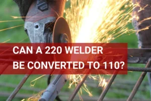 Close-up of a metalworker with an angle grinder, sparks flying, showcasing tools for welding conversion from 220 to 110 volts.