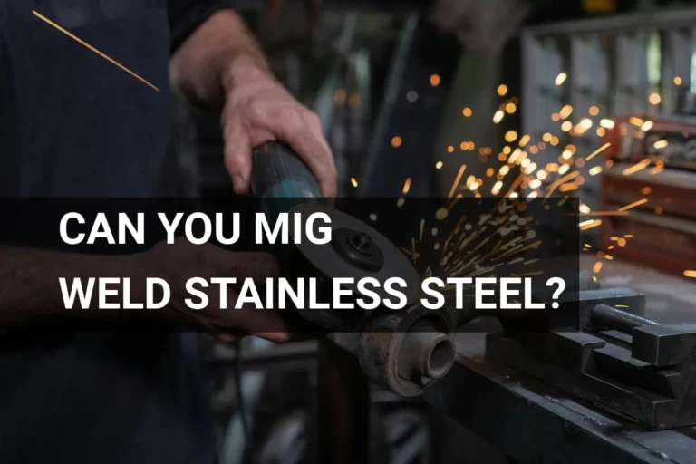 Man MIG welding stainless steel in a workshop, with sparks flying from metal grinding.