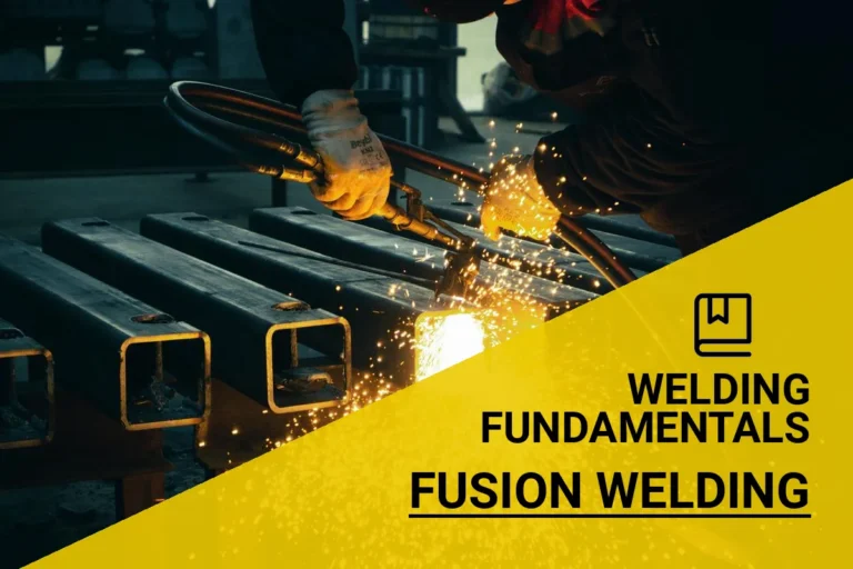 Industrial worker performing fusion welding on metal beams, creating strong joints in a factory environment.