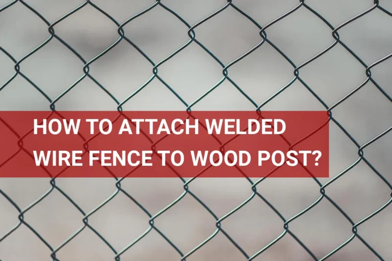 Closeup image of welded wire fence attached to wooden post, showcasing the connection method for effective fencing installation.