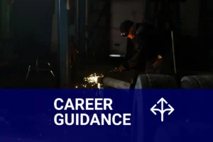 A certified welding inspector examines a metal structure in a workshop, ensuring quality and safety standards are met.