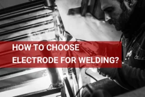 Close-up of a welder selecting the right electrode for optimal welding performance.