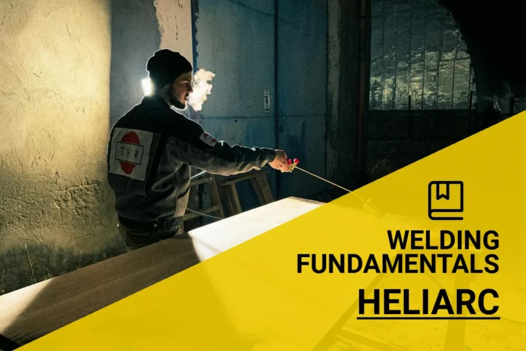 A skilled welder demonstrates heliarc welding techniques, showcasing precision and expertise with specialized equipment.