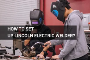 Welders using a Lincoln Electric welder in protective gear focus on a project in a well-equipped workshop.