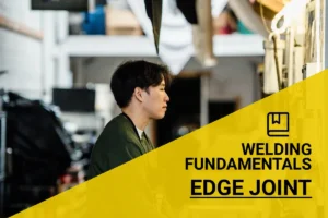 Welding an edge joint with precision and skill in a professional workshop environment.