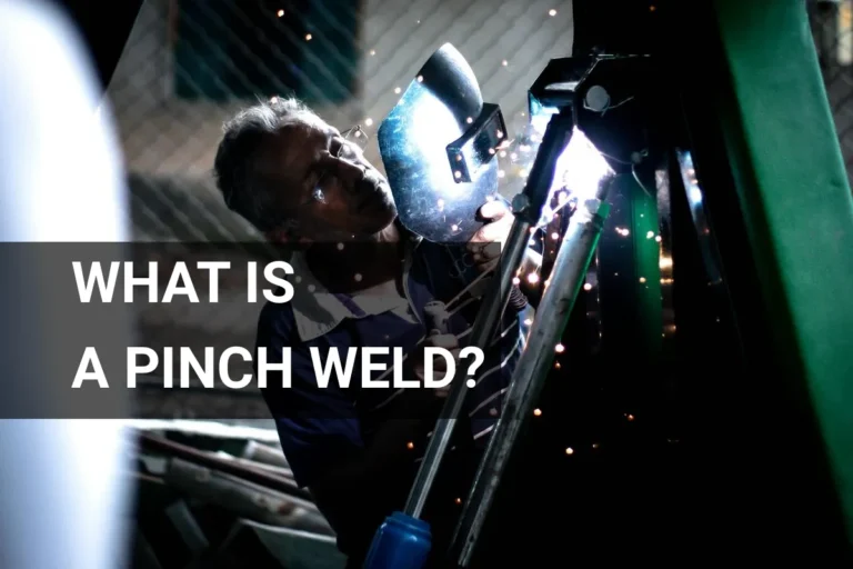 A skilled welder expertly applying techniques on a pinch weld, surrounded by safety gear and creating vibrant sparks indoors.