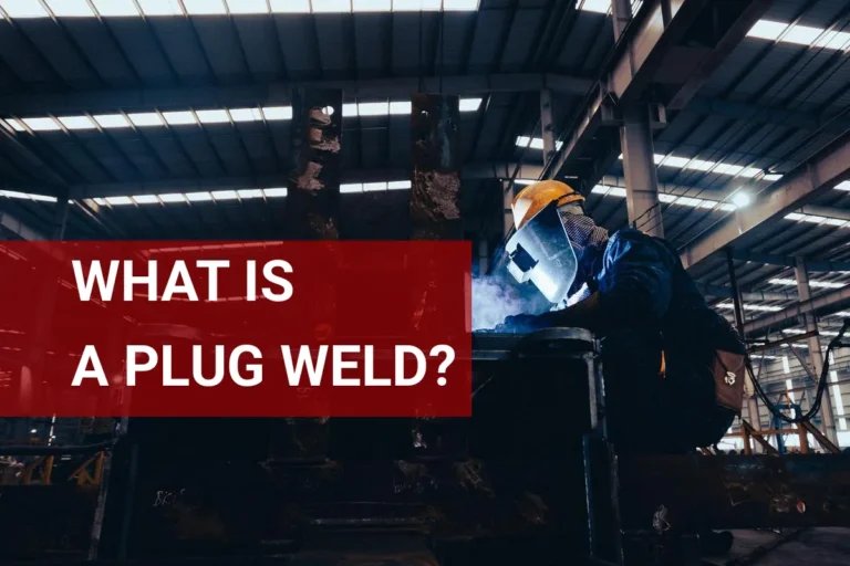 A skilled welder performs a plug weld on metal components in a well-equipped industrial workshop, highlighting the importance of safety and precision in welding techniques.