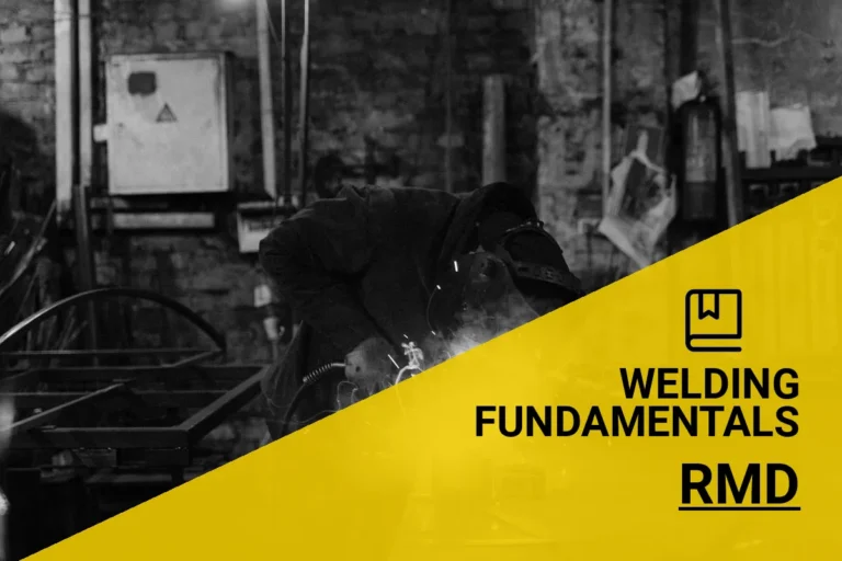 A monochrome image of a welder using RMD welding techniques in an industrial workshop, with sparks flying from the metalwork process.