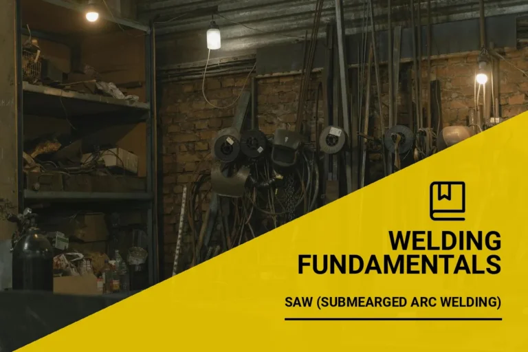 Welding workshop showcasing saw welding tools, machinery, and metal supplies in a dimly lit environment.