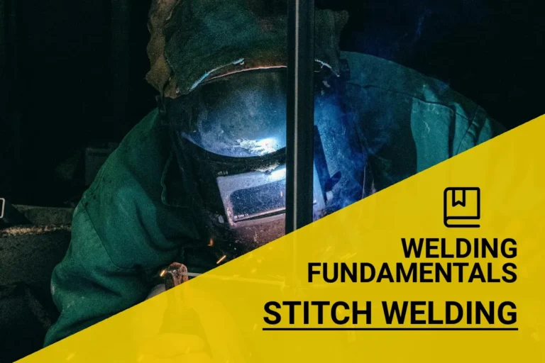 Welder performing stitch welding in a Mellieħa workshop, equipped with safety gear and surrounded by sparking welding activity.