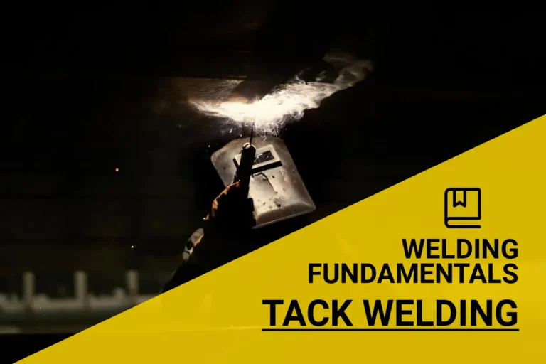 A silhouette of a welder performing tack welding, generating bright sparks in a dark industrial environment.