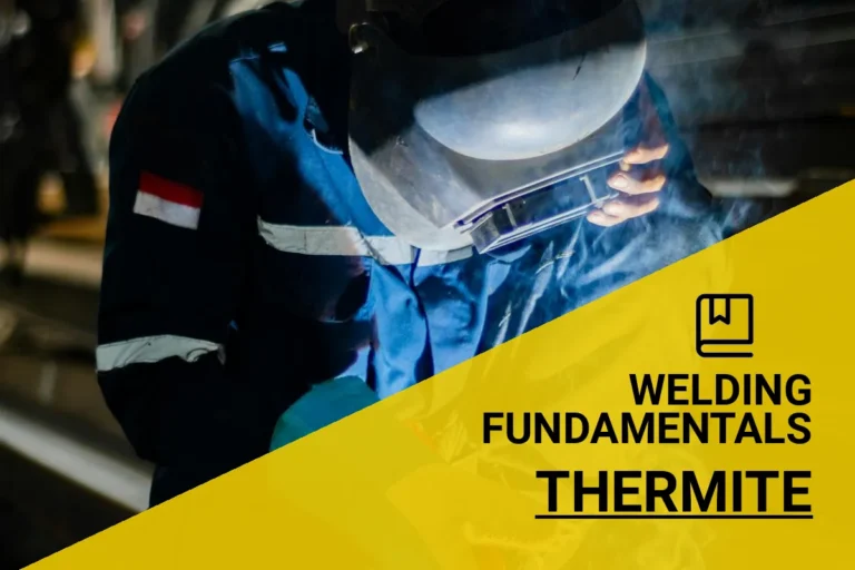 Thermite welding process in action with a skilled welder in a factory setting.