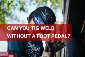 A skilled welder working outdoors, creating sparks while successfully tig welding without a foot pedal, showcasing focus and safety in the process.