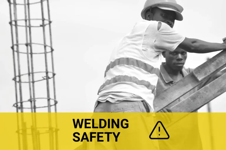 Underwater welders in safety gear at a worksite, highlighting the dangers of underwater welding.