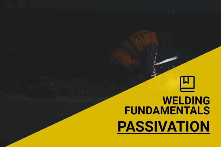 A skilled welder performing passivation techniques, creating sparks in a low-light environment while wearing necessary safety gear.