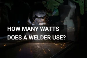 Welder using high wattage equipment in a dimly lit workshop, creating sparks while working on metal.