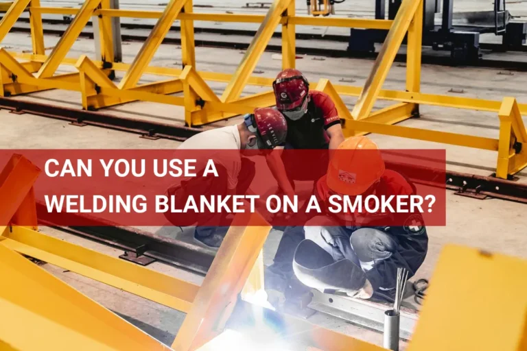 Workers using a welding blanket to protect equipment while smoking meat, showcasing safe practices for combining welding and outdoor cooking.