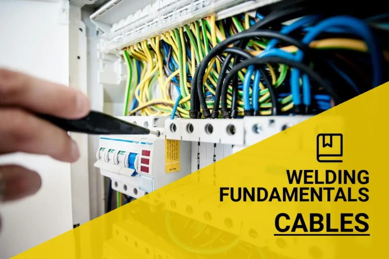 Electrician handling vibrant welding cables, showcasing their durable materials and importance in ensuring safe electrical connections.