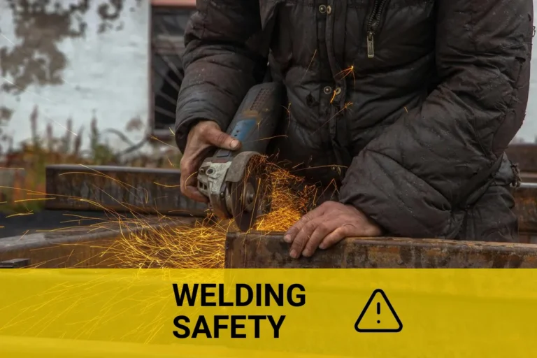 Close-up of a welding worker applying safety measures to prevent cancer, showcasing protective gear and proper techniques while using a grinder on metal beams, with sparks flying.