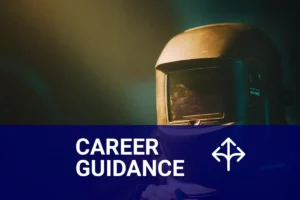 A skilled welder focused on their craft, wearing a protective helmet in a dimly lit workshop, representing the journey on how to become a welder.