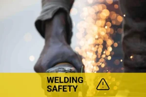 Welding sparks flying during metal cutting, highlighting the dangers of welding processes.