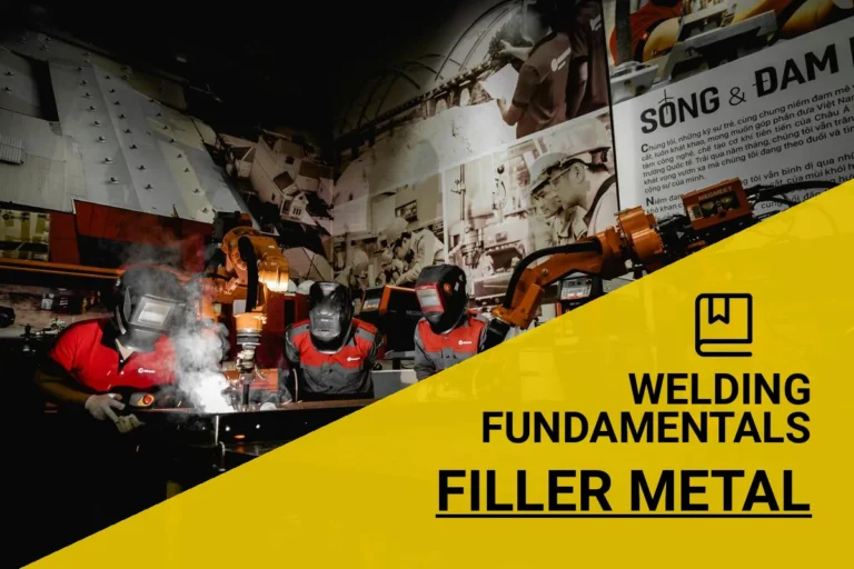 Welders in protective gear expertly adding filler metal in a 3F weld process within a modern industrial workshop.