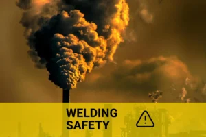 Protective measures against inhaling welding fumes highlighted against a backdrop of industrial air pollution at sunset.