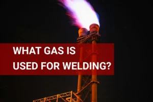 Close-up view of a gas flame from an industrial facility, illustrating the type of gas used for welding processes.