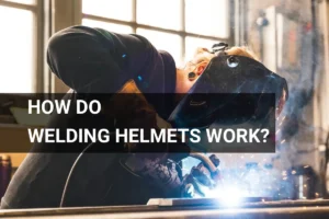 A welder wearing a protective welding helmet in action, with sparks flying in an industrial environment.