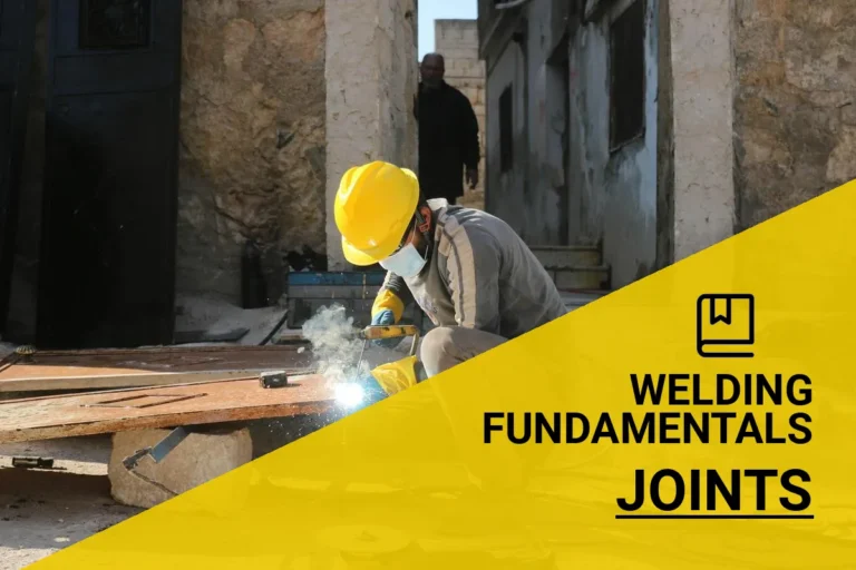 Welding joints types explained, showcasing a construction worker in Idlib, Syria, using protective gear while performing welding outdoors.