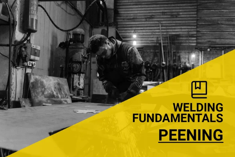 A skilled worker performing peening in welding, enhancing metal strength in an industrial factory setting, captured in black and white.