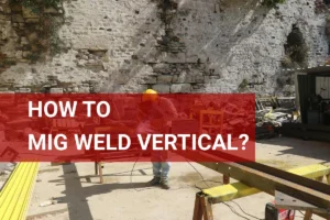 Welder in safety gear performing vertical MIG welding on a steel beam at a construction site.