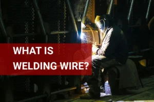 A skilled welder expertly using high-quality welding wire in an industrial factory for precise metal fabrication.