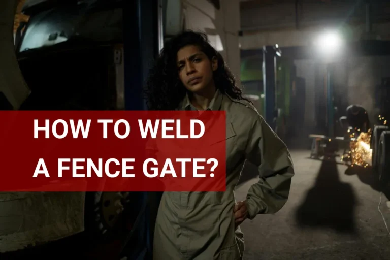 Woman mechanic confidently welding a fence gate in a gritty workshop, showcasing her skills and expertise in metalworking.